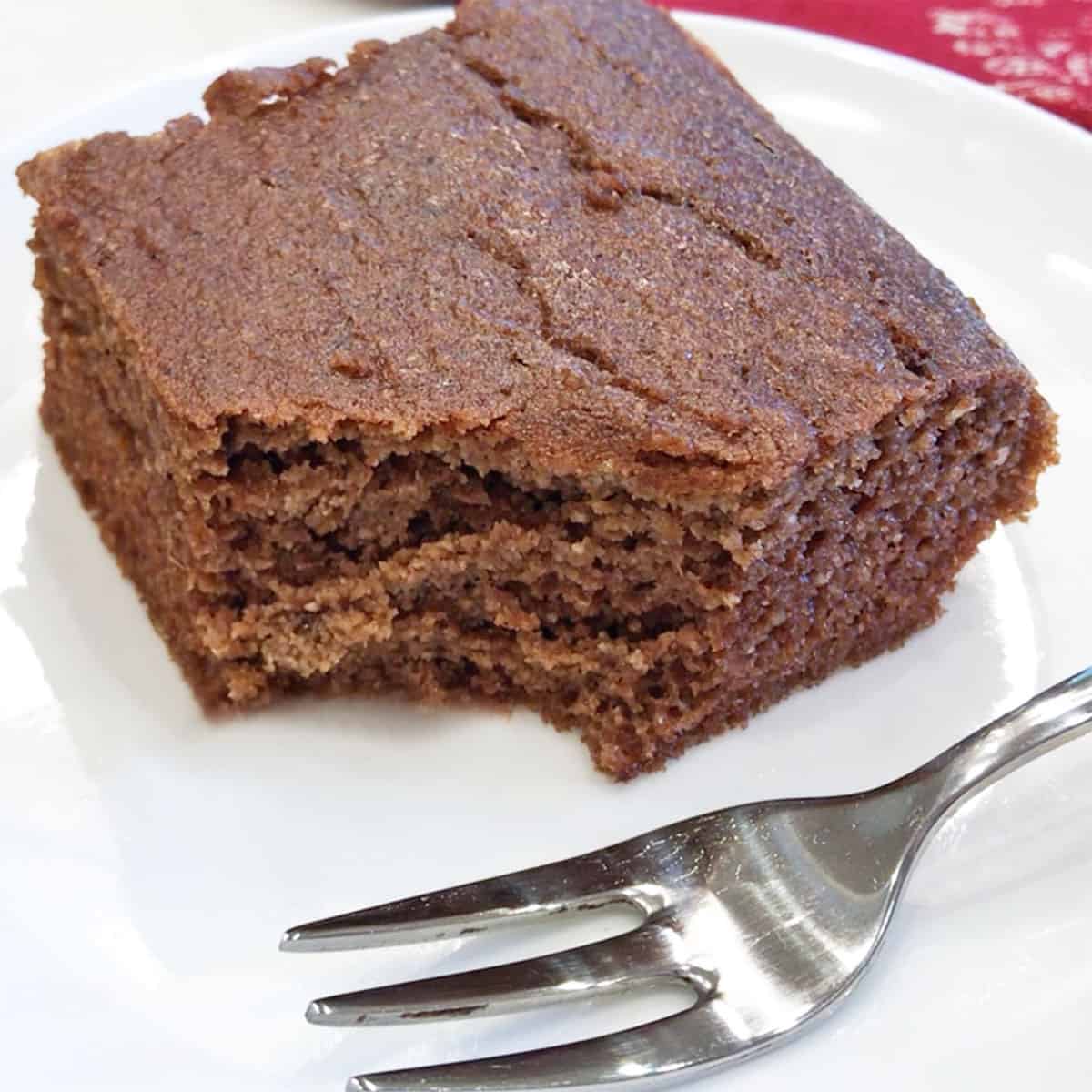 A keto gingerbread slice is served with a fork.