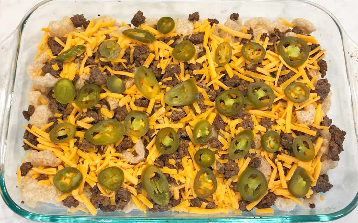The nachos are ready for the oven.