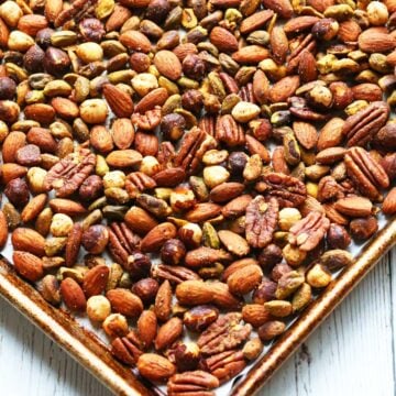 Roasted nuts on a baking sheet.