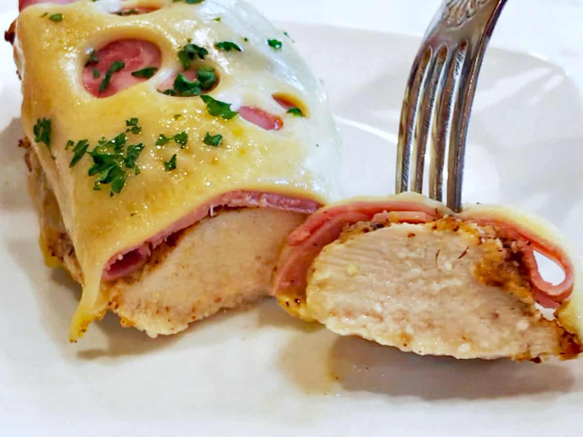 Showing the inside of the chicken and how it's cooked through but juicy.