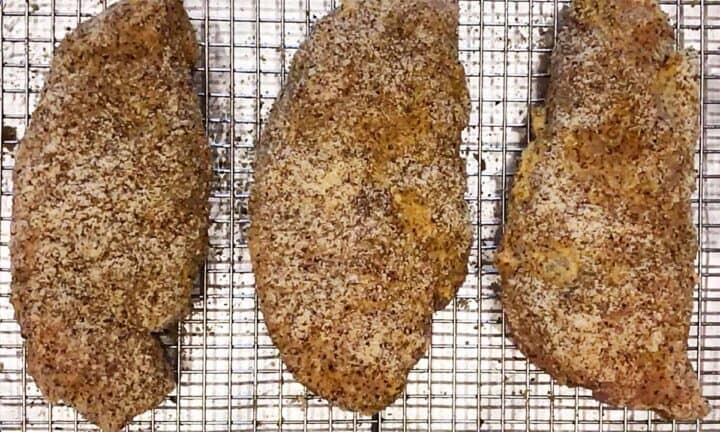 The coated chicken is ready for the oven.