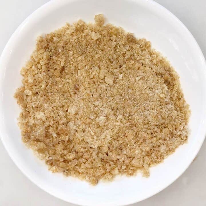 Crushed pork rinds in a bowl.