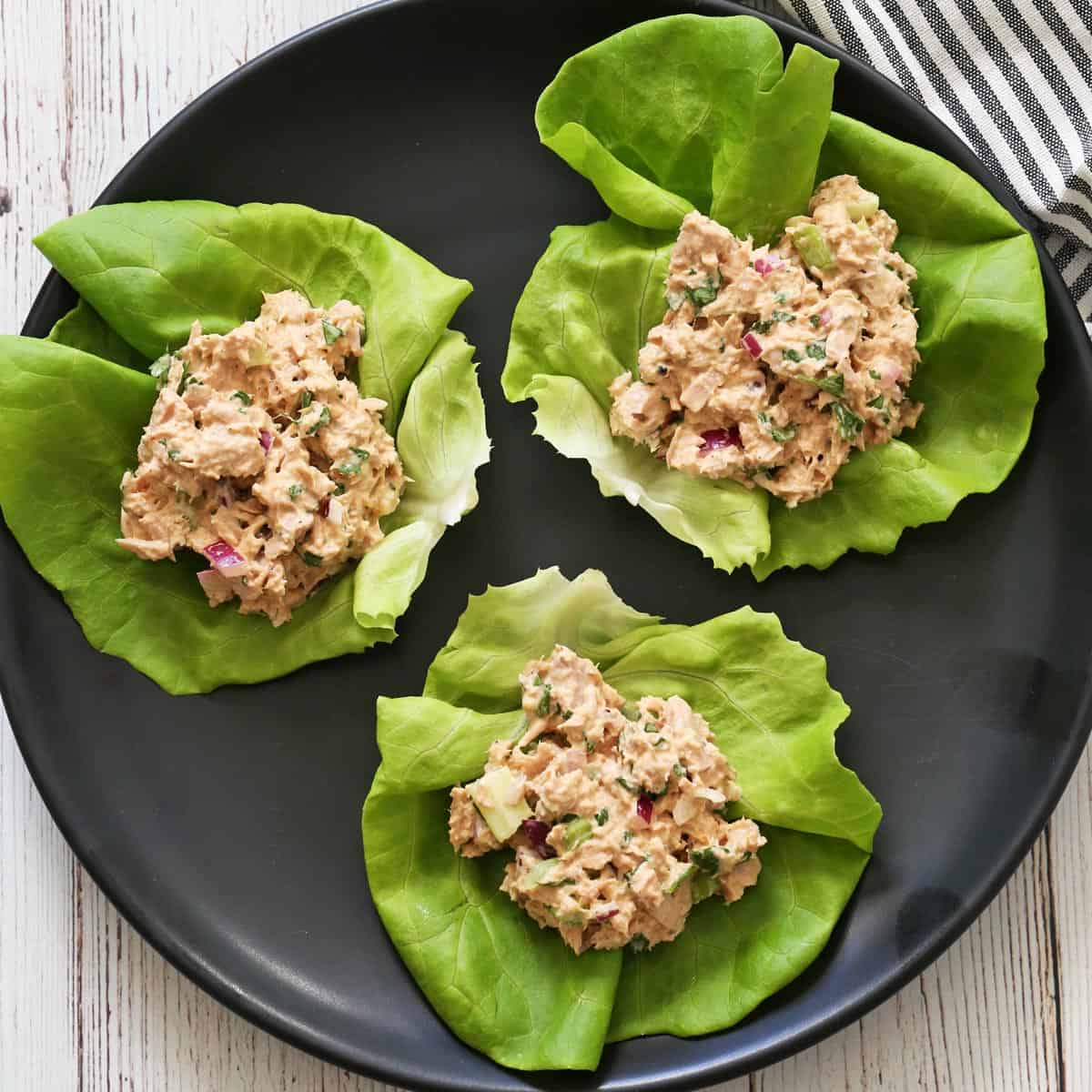 Tuna salad is served in lettuce wraps.