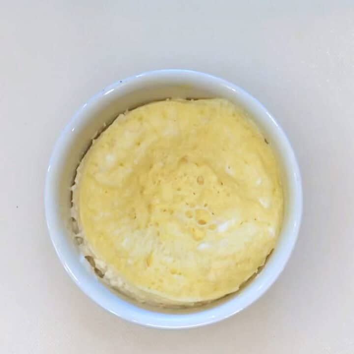 The cake in the ramekin after microwaving.