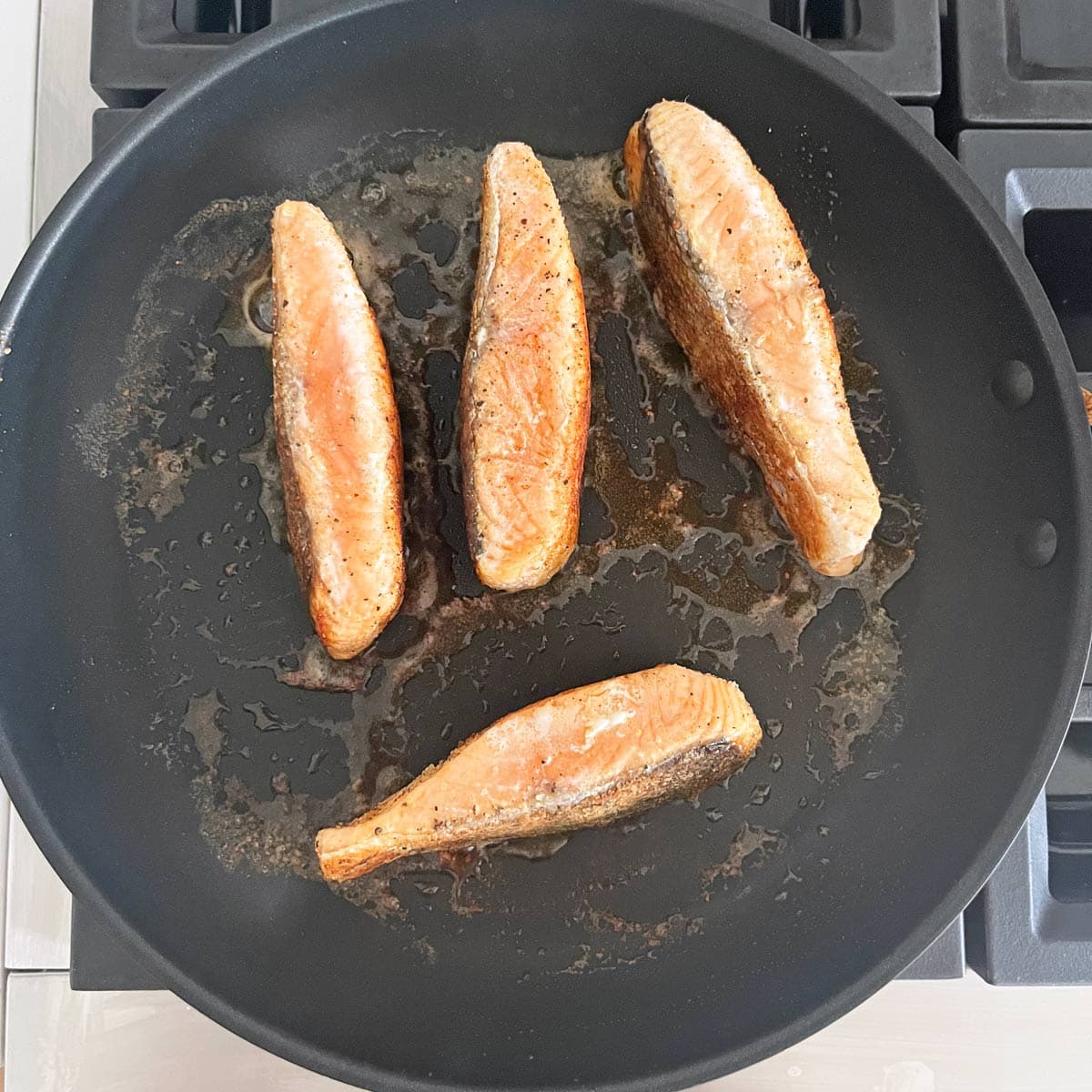 Cooking the salmon edges.