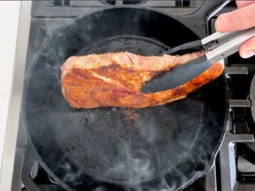 Cooking the steak's edges.