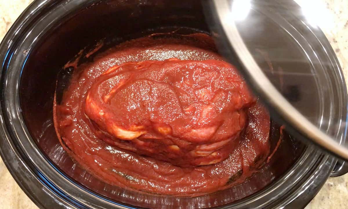 The pork was covered in BBQ sauce.