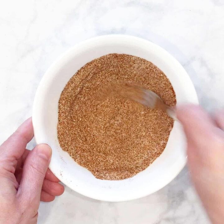 Mixing the spices in a bowl.