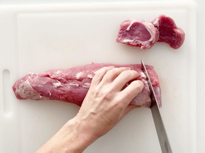 Slicing the pork tenderloin.