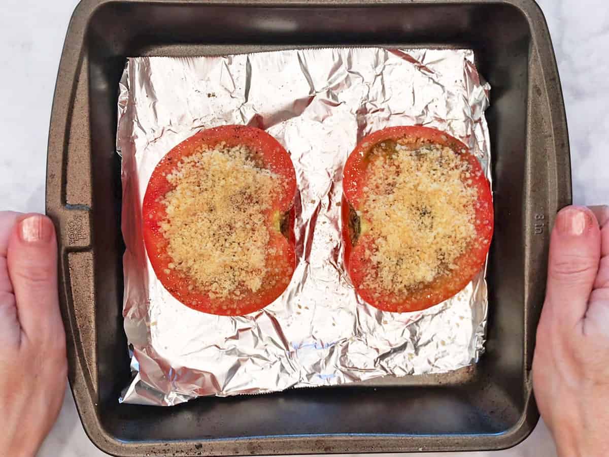 The tomatoes were topped with parmesan.
