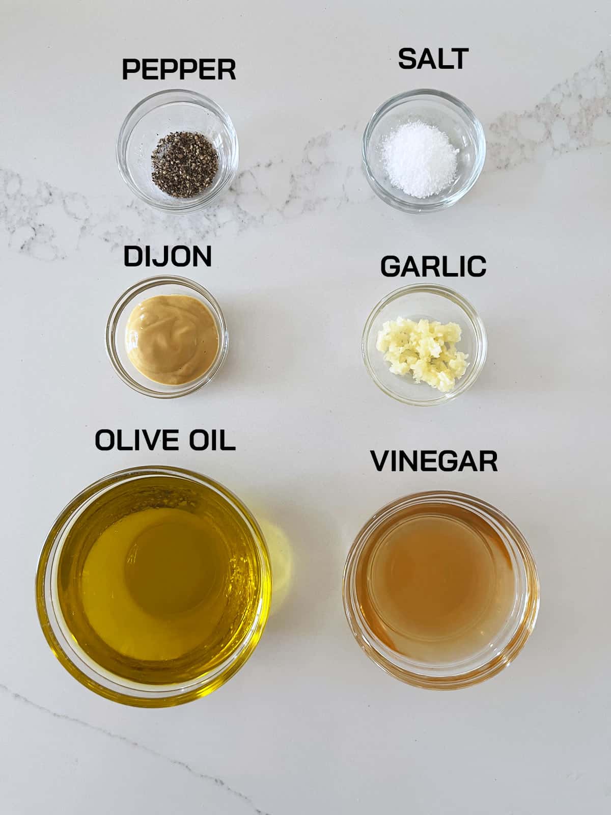 The ingredients needed to make a classic vinaigrette.