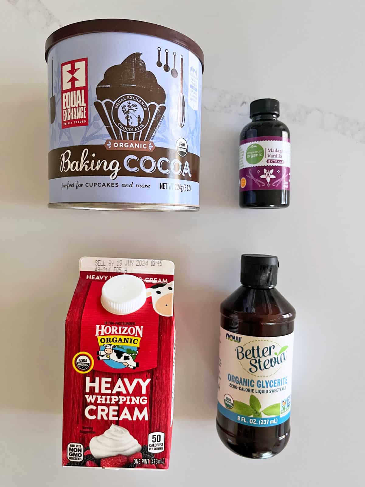 The ingredients needed to make keto chocolate whipped cream.