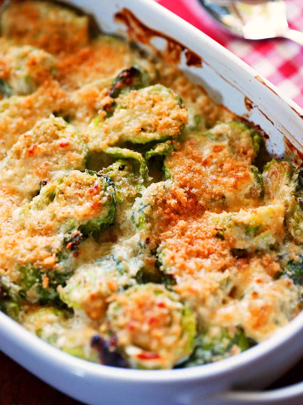 Brussels sprouts casserole is served in a baking dish.