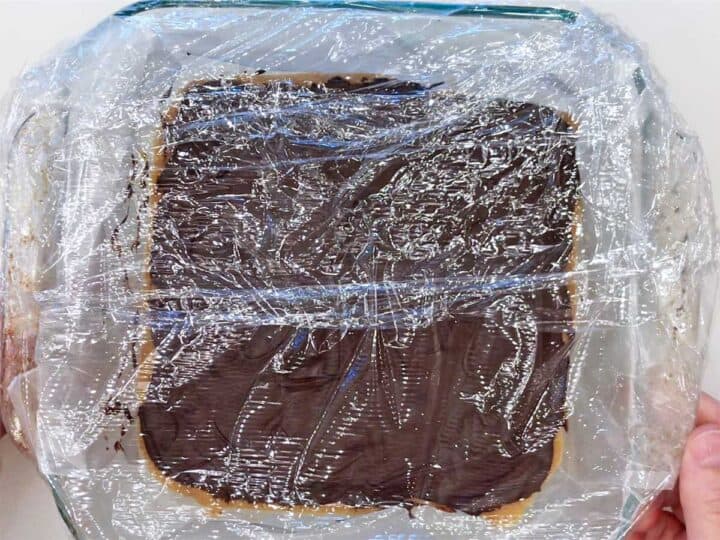 Wrapping the pan in cling wrap.