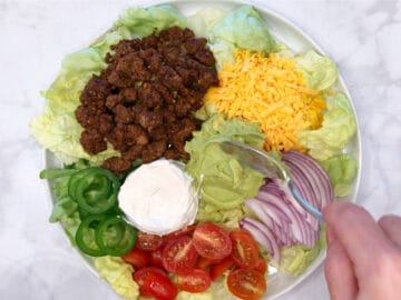 Assembling the salad.