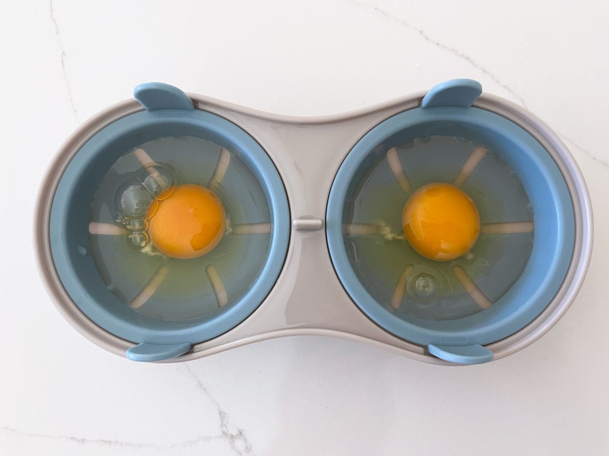 Two eggs in a microwave poacher.