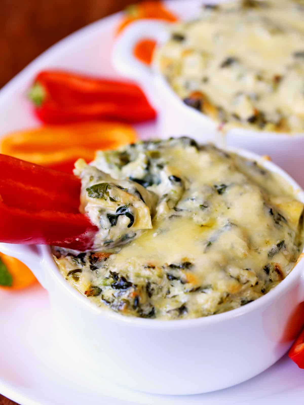 Spinach artichoke dip was baked in two smaller baking dishes.