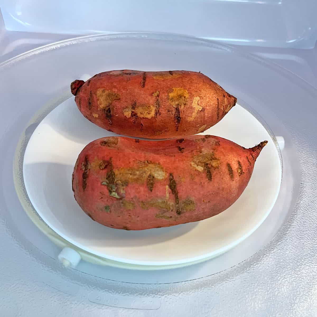 Microwaving two potatoes at the same time.