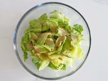 The dressing was added to the salad.