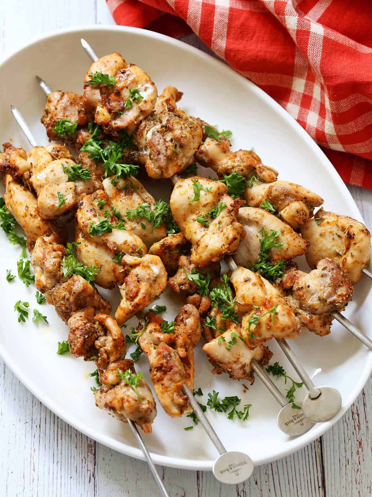 Grilled chicken skewers made with chicken thighs.