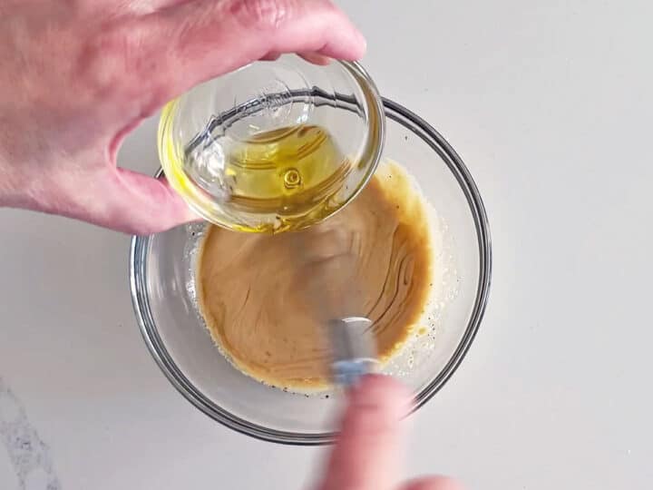 Mixing the dressing.