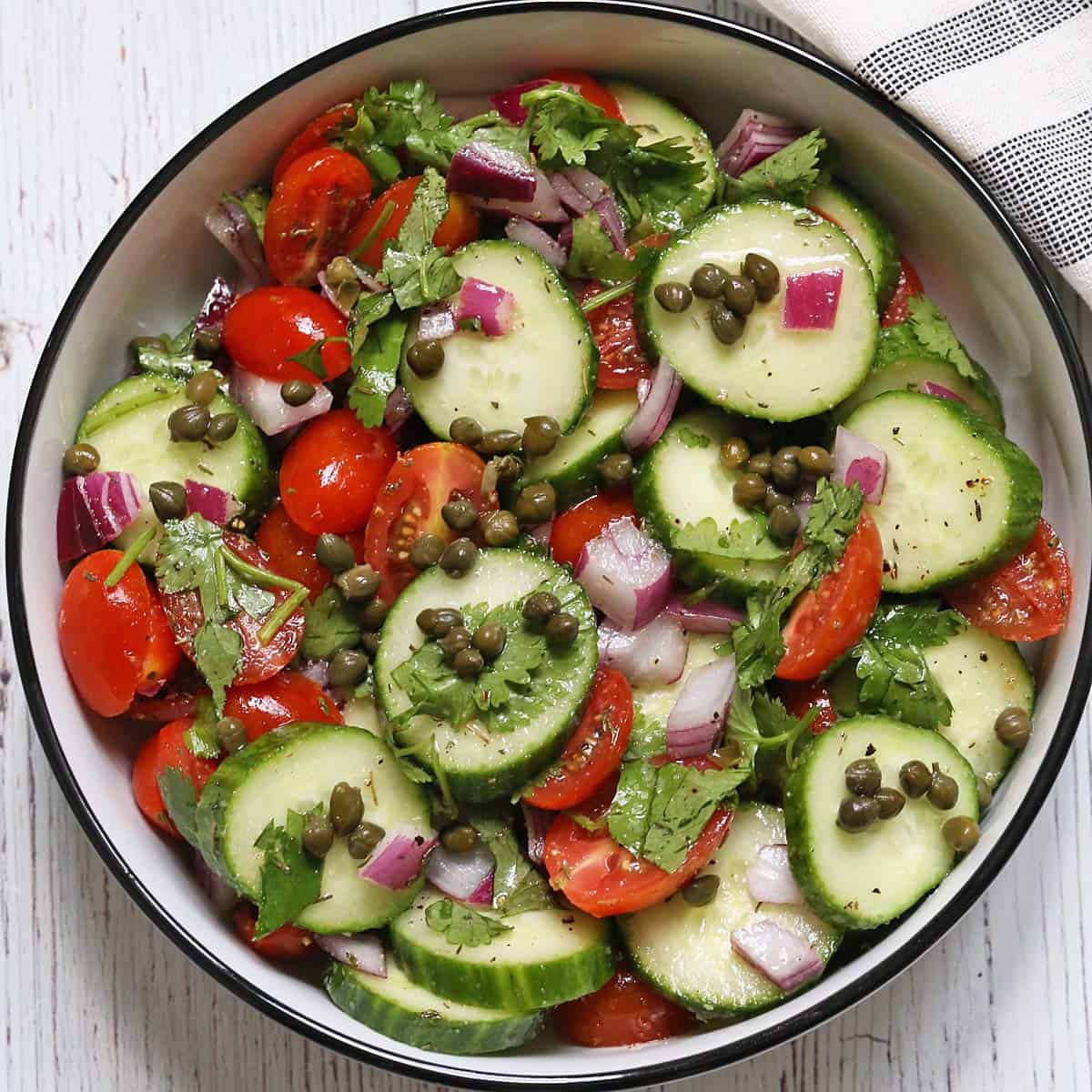 Cucumber tomato salad with added capers.