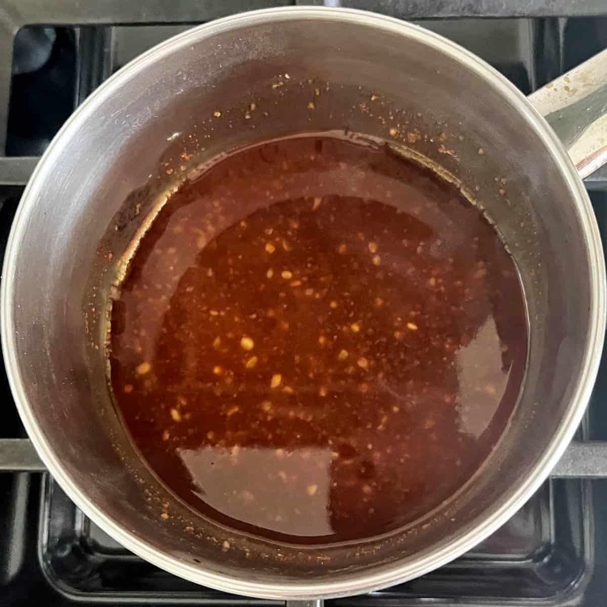 Cooking the sauce in a small saucepan.