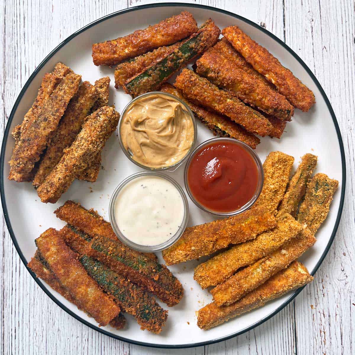 Zucchini fries are served with three dips.