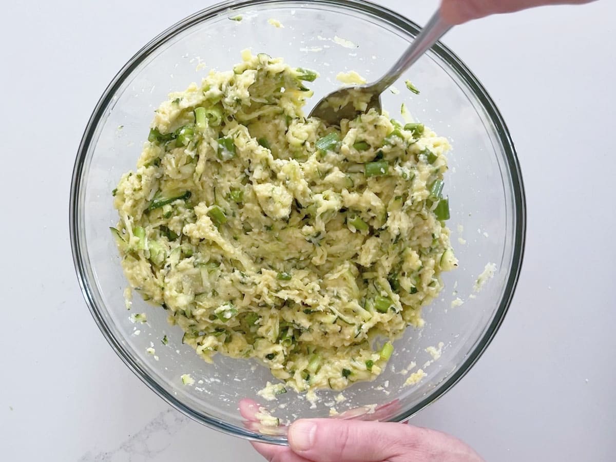 Mixing the fritter ingredients in a bowl.