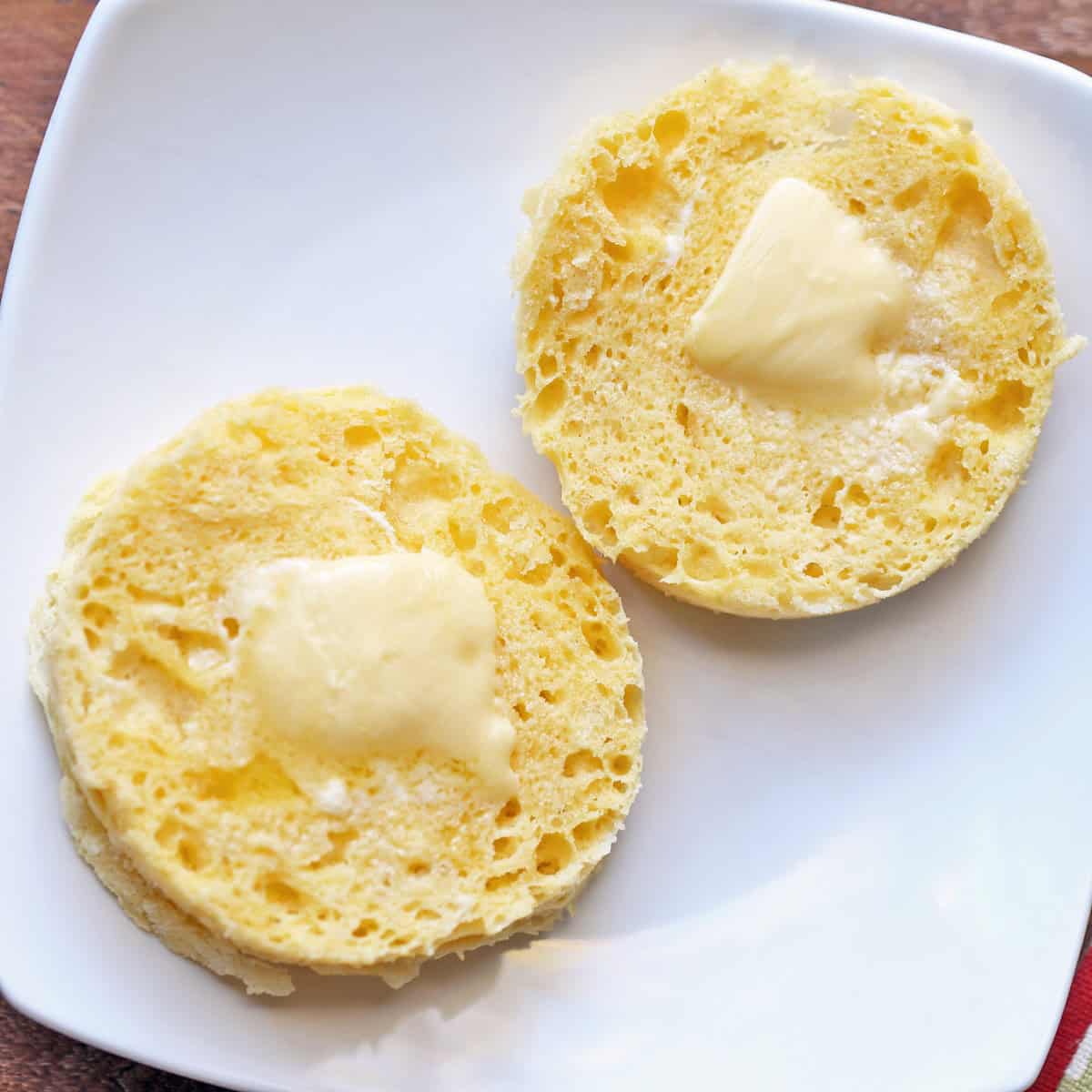 Untoasted 90 second bread is topped with butter.