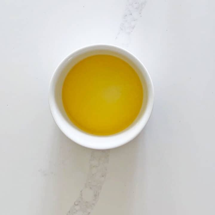 Melted butter in a ramekin.