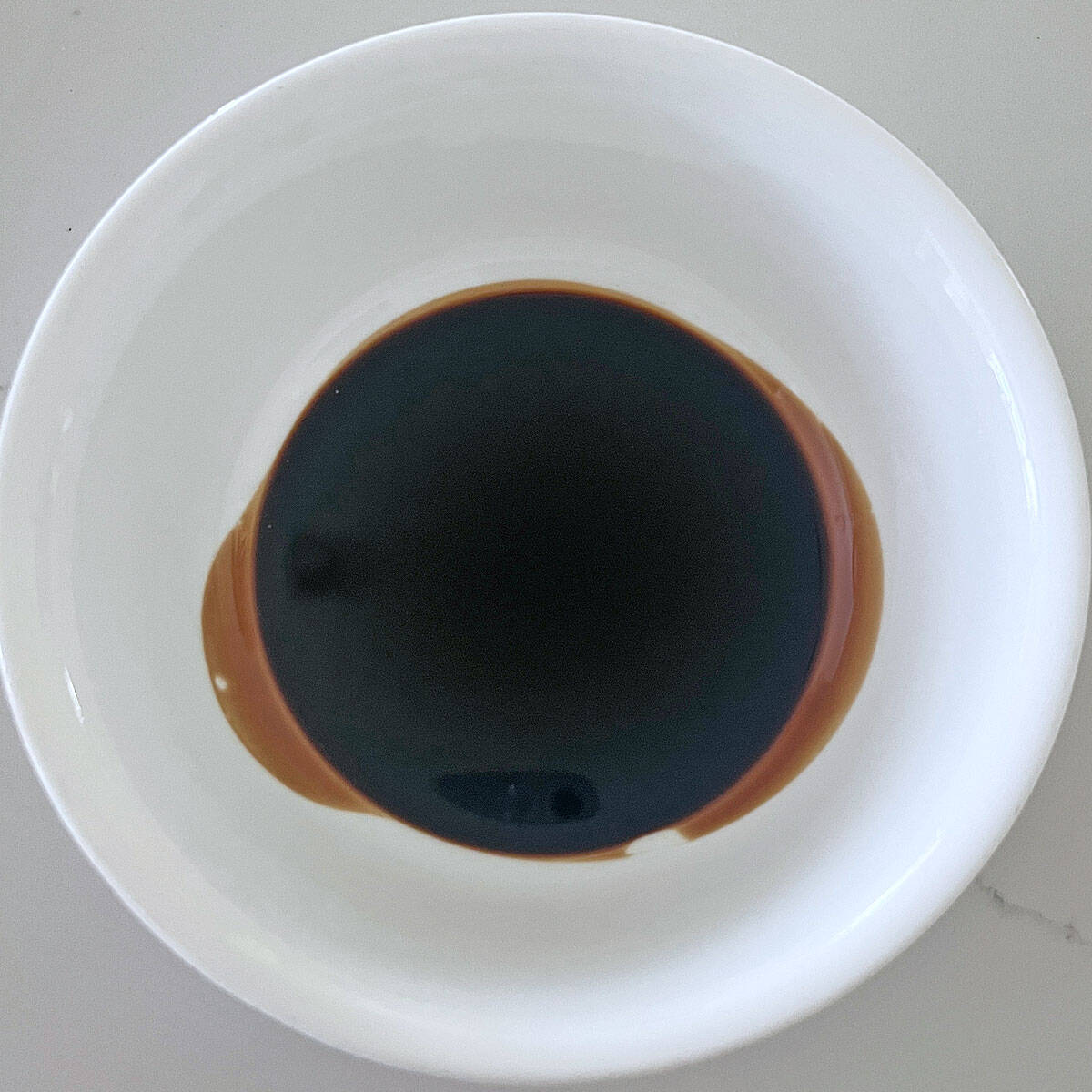Aged balsamic vinegar in a bowl.