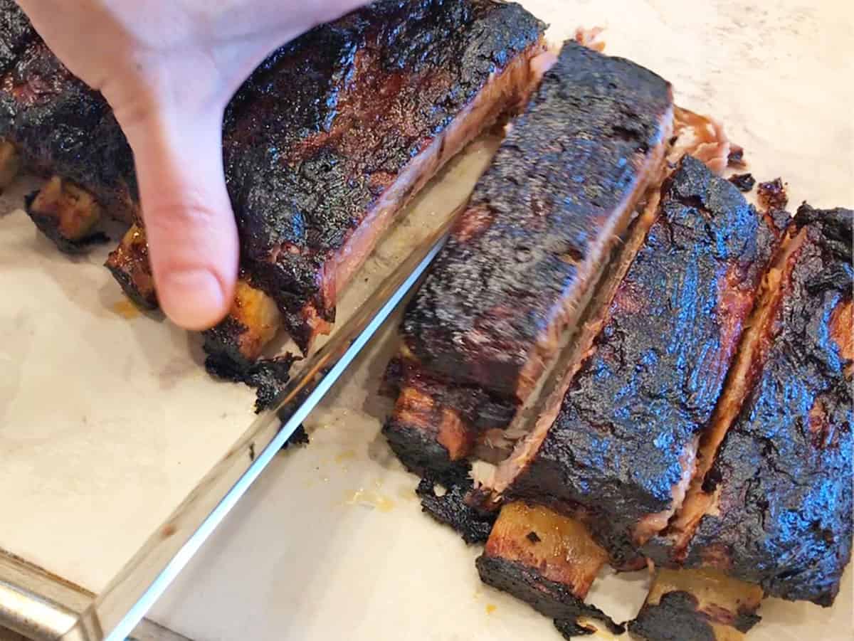 Cutting the ribs.