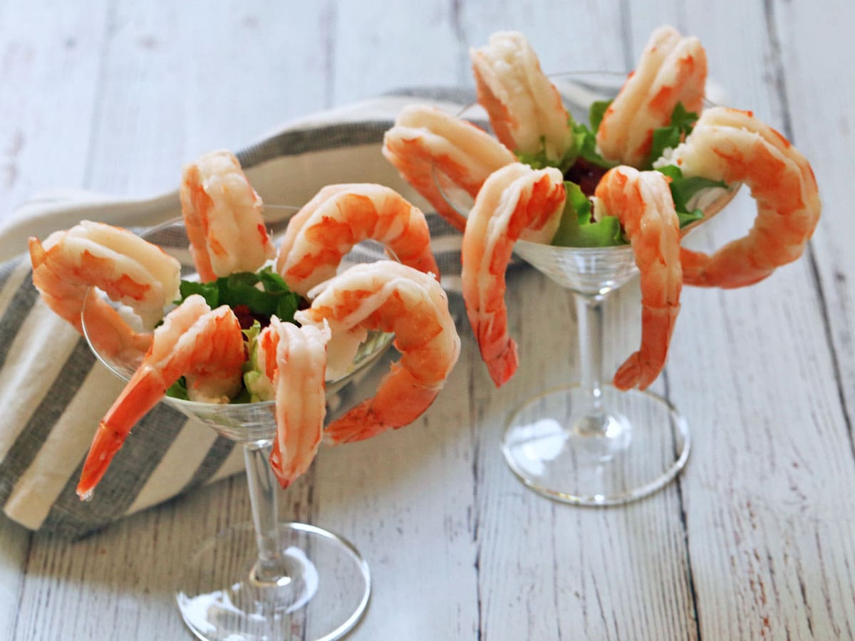 Shrimp cocktail is served in martini glasses.