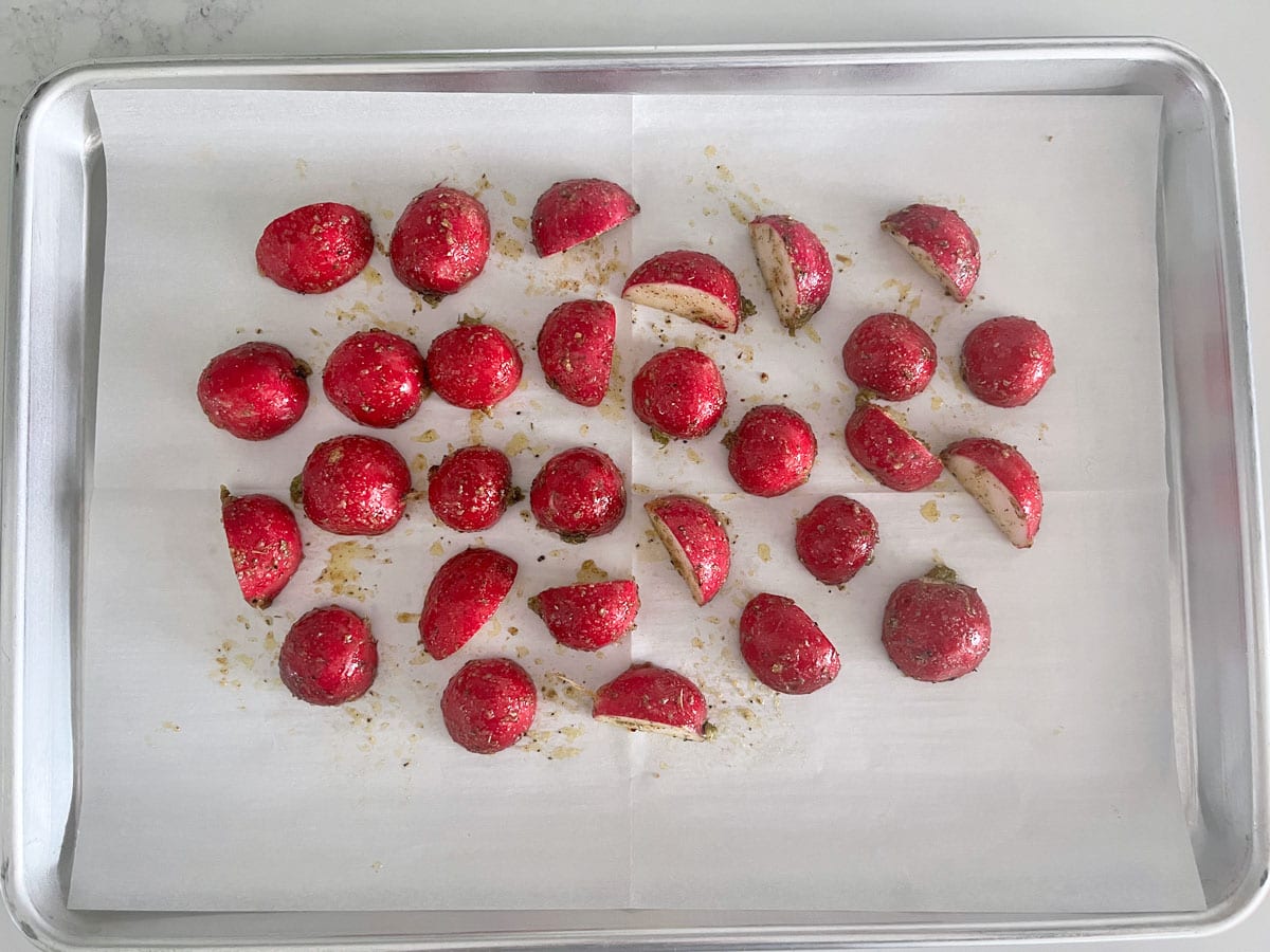 Roasting the radishes in a sheet pan.