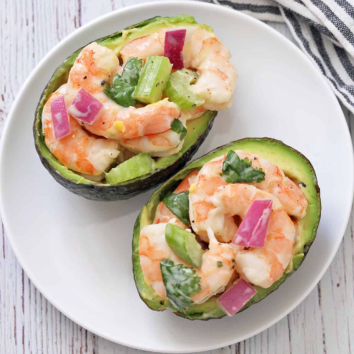 Shrimp salad is served in avocado halves.