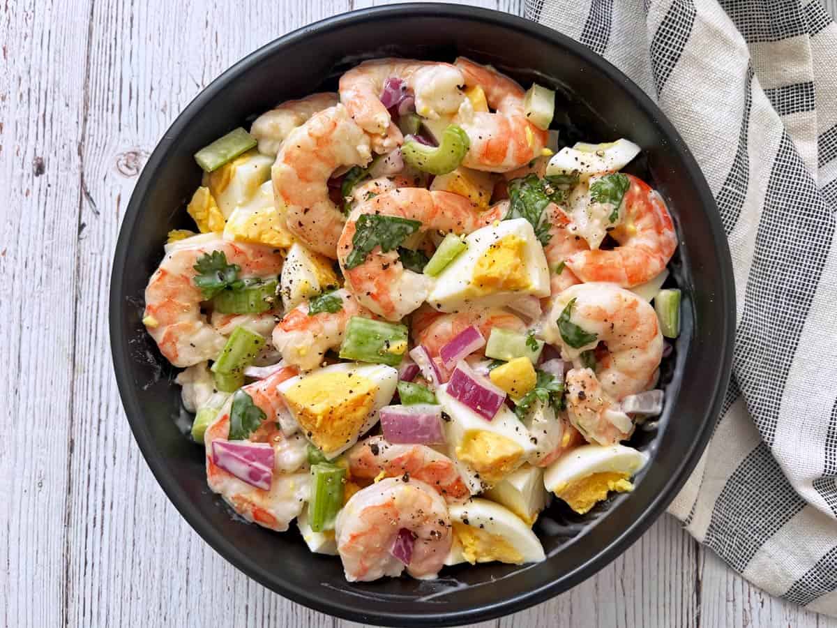 Hard-boiled eggs were added to a shrimp salad.
