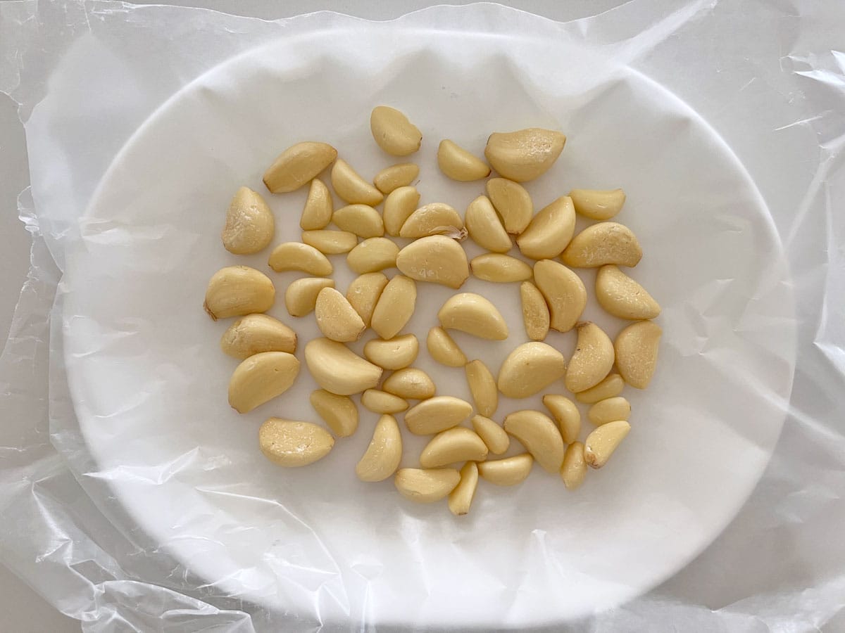 Freezing garlic cloves on wax paper.