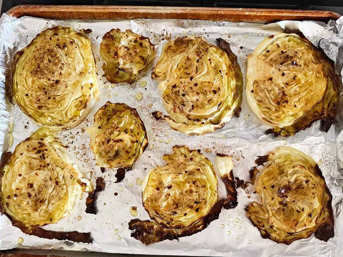 Round cabbage slices on a pan.