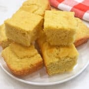 Keto cornbread is served on a white plate.