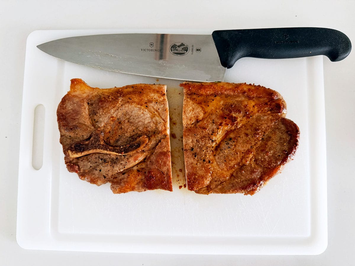 A large pork steak was halved.