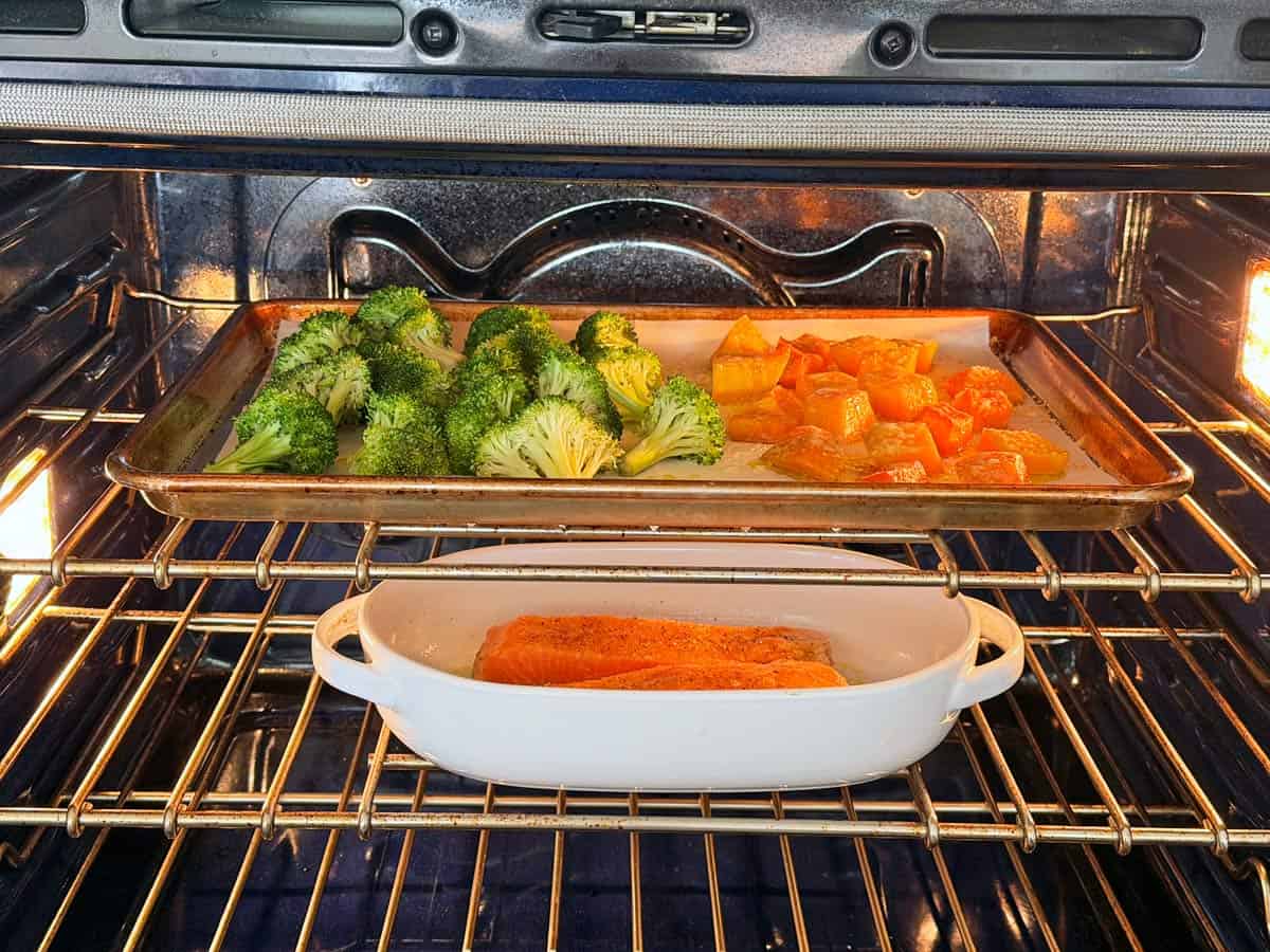 Squash, broccoli, and salmon in the oven.