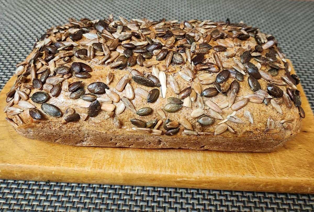 Almond flour bread is topped with sunflower seeds.