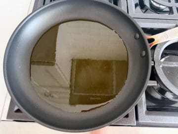 Four tablespoons of oil in a skillet.