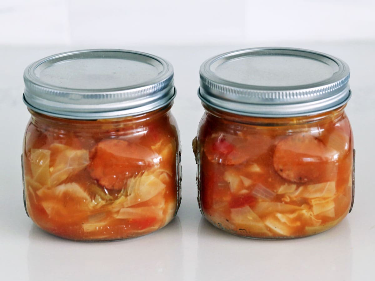 Cabbage soup leftovers are stored in Mason jars.