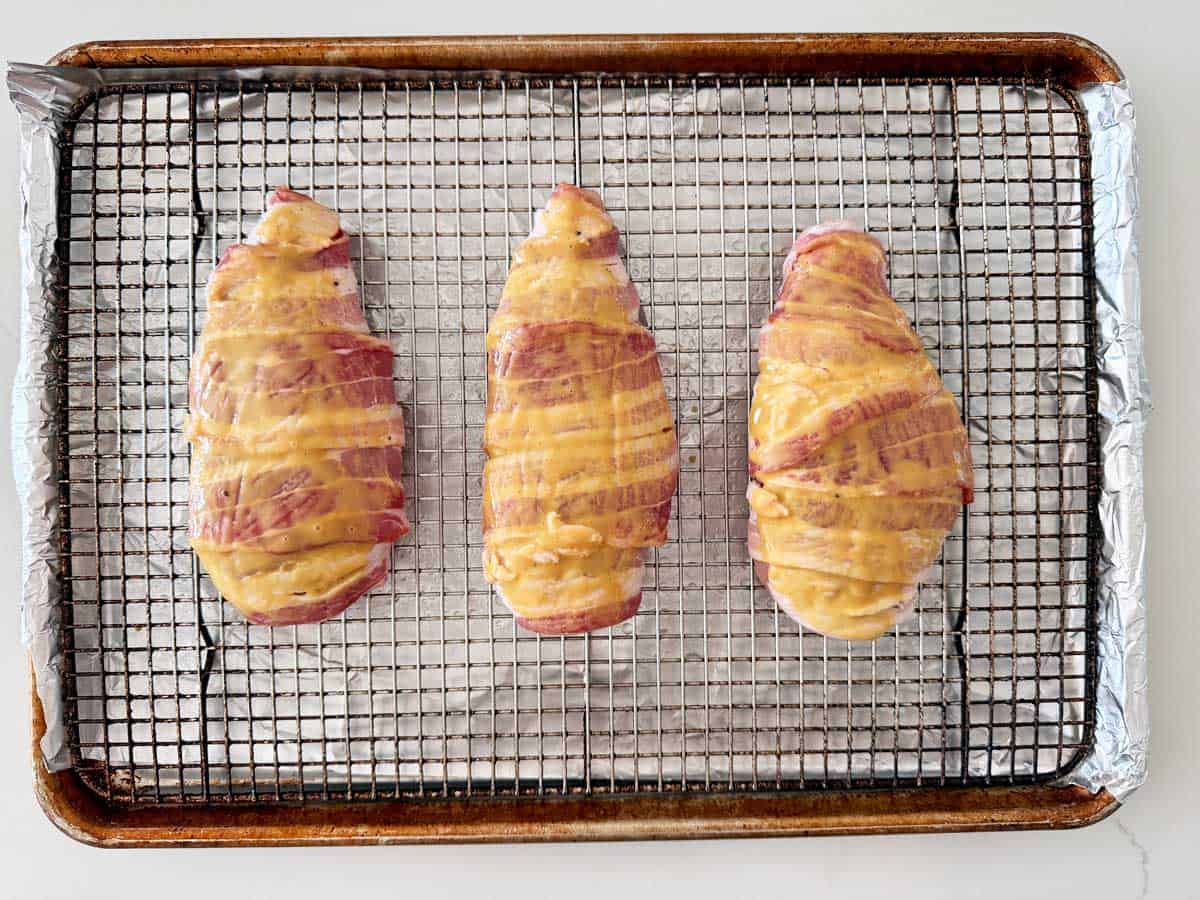 The bacon wrapped chicken was coated with a honey-mustard glaze.