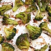 Roasted frozen broccoli on a baking sheet.